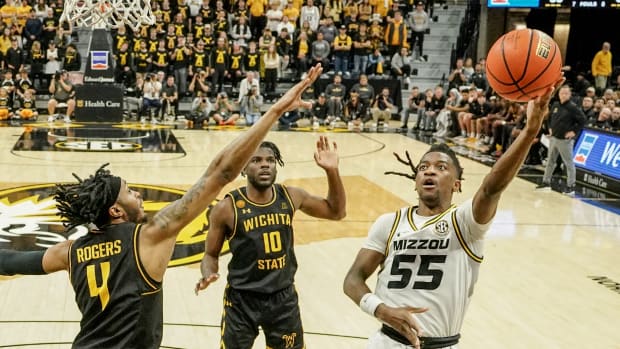Dec 3, 2023; Columbia, Missouri, USA; Missouri Tigers guard Sean East II (55) shoots as Wichita State Shockers guard Colby Rogers (4) defends during the second half at Mizzou Arena.