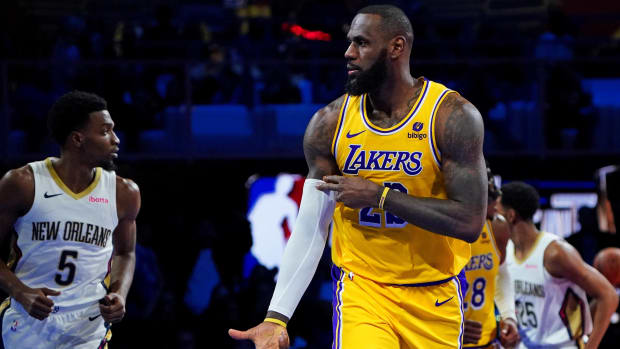 Lakers forward LeBron James celebrates hitting a three-pointer during a game against the Pelicans.