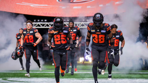 Jun 17, 2023; Vancouver, British Columbia, CAN; BC Lions running back Taquan Mizzell (25) and defensive back Quincy Mauger (36) run onto the field prior to a game against the Edmonton Elks at BC Place. Mandatory Credit: Bob Frid-USA TODAY Sports