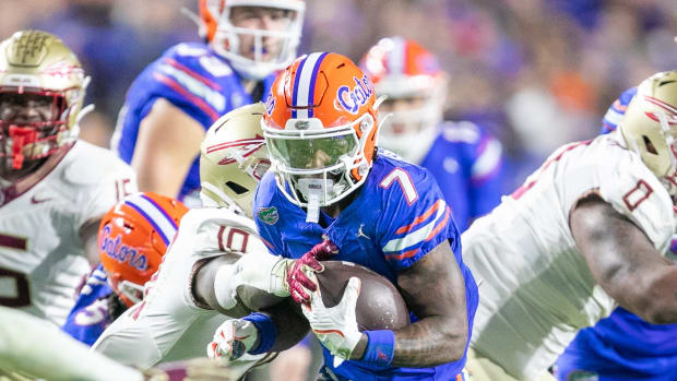 Etienne runs the ball during Florida's 24-15 loss to No. 5 Florida State on Nov. 25, 2023.