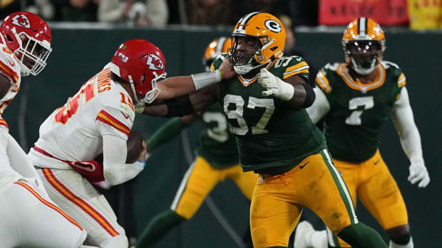 Green Bay Packers defensive tackle Kenny Clark (97) sacks Kansas City Chiefs quarterback Patrick Mahomes during the first quarter of their game Sunday, December 3, 2023 at Lambeau Field in Green Bay, Wisconsin.