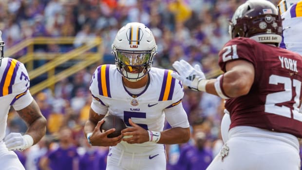 Daniels runs the ball during No. 14 LSU's 42-30 win over Texas A&M on Nov. 25, 2023.