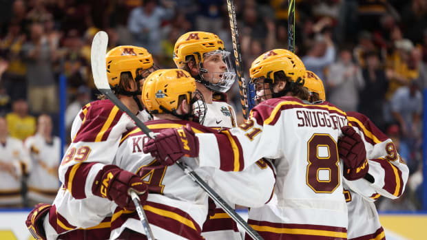 Gophers players embrace