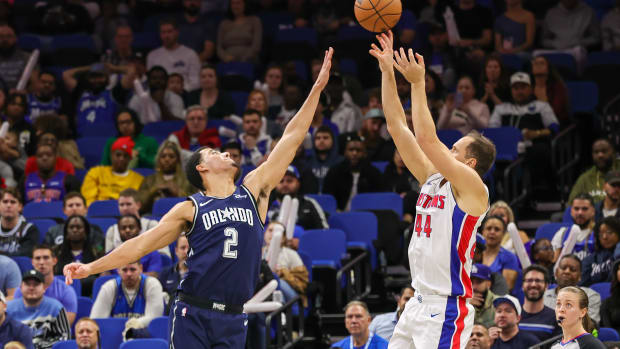 Detroit Pistons forward Bojan Bogdanovic (44) shoots the ball over Orlando Magic guard Caleb Houstan (2) during the second quarter at Amway Center.