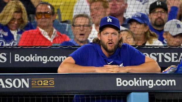 Oct 9, 2023; Los Angeles, California, USA; Los Angeles Dodgers starting pitcher Clayton Kershaw (22) looks on from the dug out against the Arizona Diamondbacks during the third inning for game two of the NLDS for the 2023 MLB playoffs at Dodger Stadium. Mandatory Credit: Jayne Kamin-Oncea-USA TODAY Sports