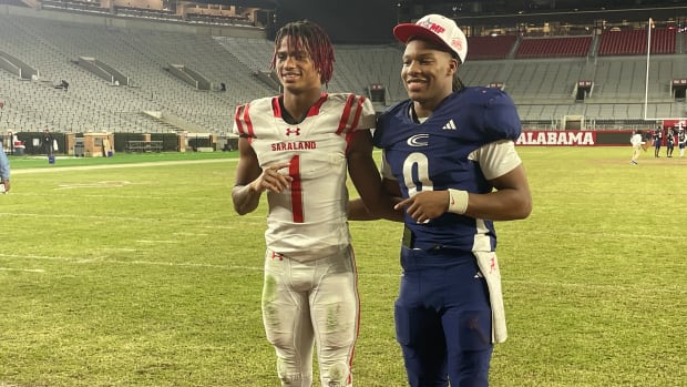 Clay-Chalkville QB/CB Jaylen Mbakwe and Saraland WR Ryan Williams taking a picture after the AHSAA 6A State Championship.