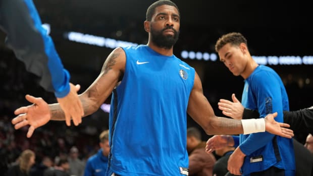 Dec 8, 2023; Portland, Oregon, USA; Dallas Mavericks point guard Kyrie Irving (11) is introduced as part of the starting lineup before the game against the Portland Trail Blazers at Moda Center. Mandatory Credit: Soobum Im-USA TODAY Sports  