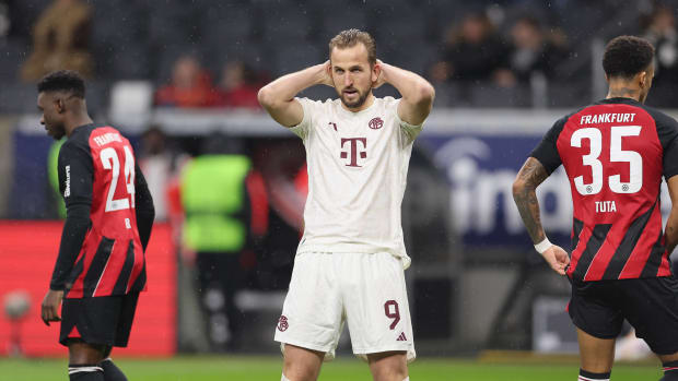 Harry Kane pictured (center) looking dejected during Bayern Munich's 5-1 defeat at Eintracht Frankfurt in December 2023