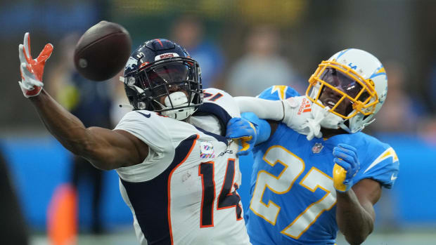 Denver Broncos wide receiver Courtland Sutton (14) attempts to catch the ball as Los Angeles Chargers cornerback J.C. Jackson (27) defends in the first quarter at SoFi Stadium.