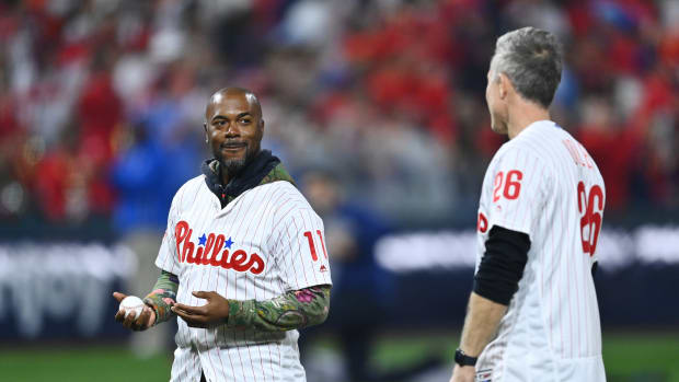 Nov 2, 2022; Philadelphia, Pennsylvania, USA; Former Philadelphia Phillies shortstop Jimmy Rollins and former second baseman Chase Utley look on prior to throwing out a ceremonial first pitch before game four of the 2022 World Series against the Houston Astros at Citizens Bank Park.