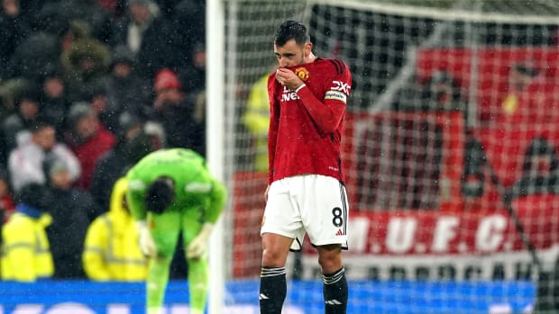 Manchester United captain Bruno Fernandes pictured looking dejected during his team's 3-0 loss to Bournemouth at Old Trafford in December 2023