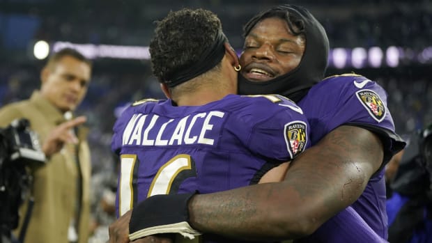 Ravens quarterback Lamar Jackson celebrates with Tylan Wallace after his 76-yard punt return for a touchdown in overtime to beat the Rams in Week 14.
