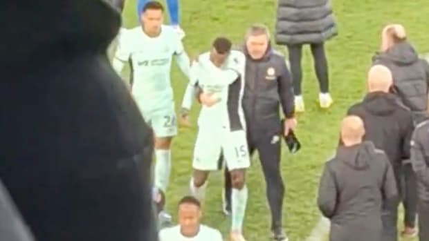 Nicolas Jackson pictured (center) being dragged off the field by a member of Chelsea's coaching staff following a 2-0 loss at Everton in December 2023