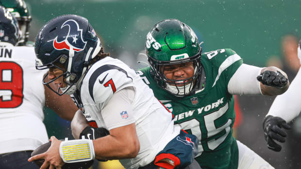 Dec 10, 2023; East Rutherford, New Jersey, USA; Houston Texans quarterback C.J. Stroud (7) is sacked by New York Jets defensive tackle Quinnen Williams (95) during the second half at MetLife Stadium. Mandatory Credit: Vincent Carchietta-USA TODAY Sports  