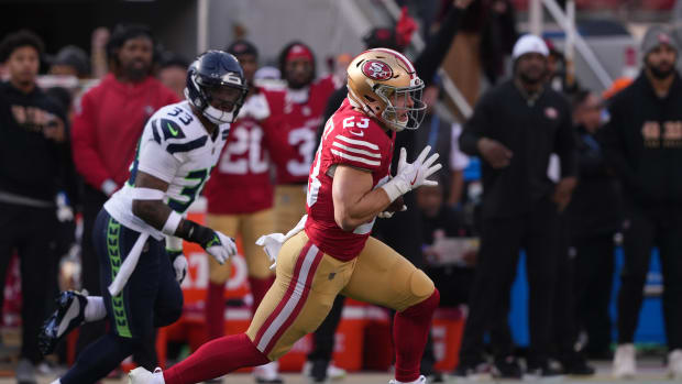 San Francisco 49ers running back Christian McCaffrey (23) carries the ball against Seattle Seahawks safety Jamal Adams (33) during the first quarter at Levi's Stadium.