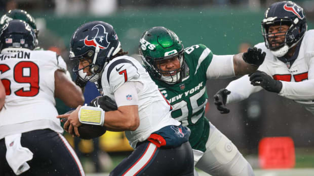 Houston Texans quarterback C.J. Stroud is sacked by New York Jets defensive tackle Quinnen Williams.
