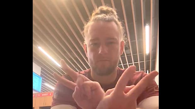 San Francisco 49ers long snapper Taybor Pepper gives a sign language response to Seattle Seahawks receiver DK Metcalf on Dec. 10, 2023.