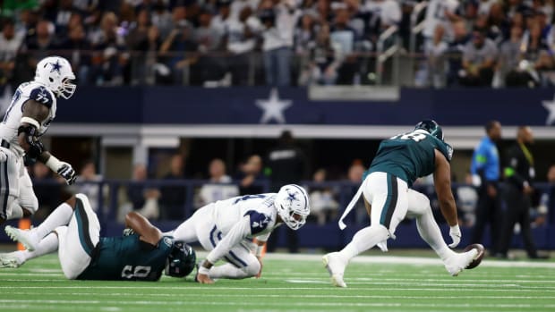 Fletcher Cox sacked Dallas Cowboys QB Dak Prescott, forcing a fumble that rookie Jalen Carter scooped up and scored from 42 yards out for the Philadelphia Eagles' lone touchdown in a 33-13 loss in Week 14.