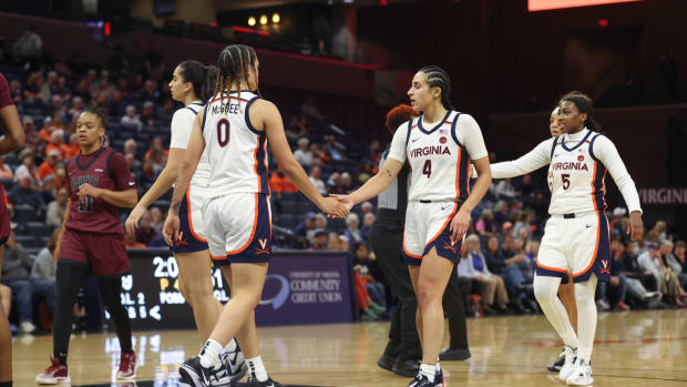 Olivia McGhee and Jillian Brown shake hands during the Virginia women's basketball game against Maryland Eastern Shore at John Paul Jones Arena.