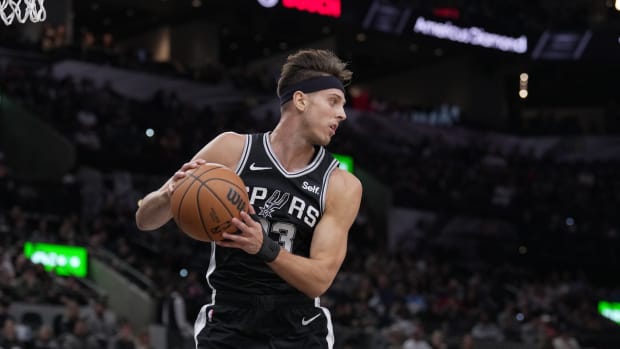 Dec 8, 2023; San Antonio, Texas, USA; San Antonio Spurs forward Zach Collins (23) brings down a rebound in the first half against the Chicago Bulls at the Frost Bank Center.