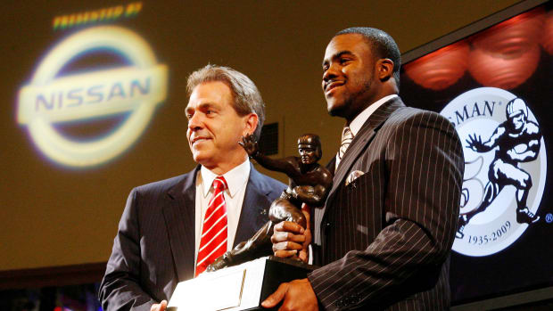 Alabama Crimson Tide running back Mark Ingram (right) poses with his coach Nick Saban after being awarded the 2009 Heisman Trophy at the Marriott Marquis in New York City.