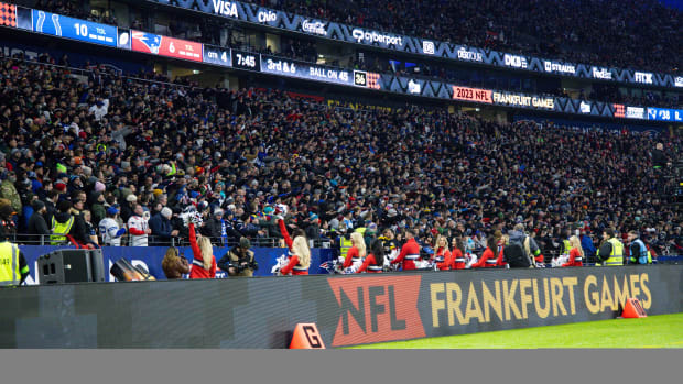a stadium full of fans with NFL Frankfurt Games written on the side barrier