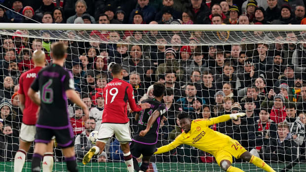 Kingsley Coman pictured (center) scoring for Bayern Munich against Manchester United in a UEFA Champions League group game at Old Trafford in December 2023
