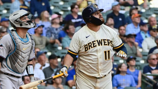 Sep 14, 2023; Milwaukee, Wisconsin, USA; Milwaukee Brewers first baseman Rowdy Tellez (11) watches after hitting a sacrifice fly against the Miami Marlins in the fourth inning at American Family Field.