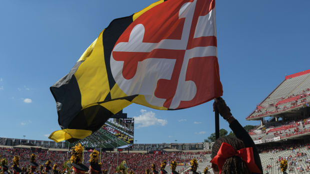 Sep 2, 2023; College Park, Maryland, USA; A member of the Maryland Terrapins spirit team holds a state flag before the game against the Towson Tigers at SECU Stadium. Mandatory Credit: Tommy Gilligan-USA TODAY Sports