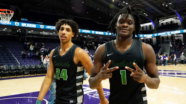 Chicago State Cougars guard Wesley Cardet Jr. (1) and guard Jahsean Corbett (24) celebrate their win against the Northwestern Wildcats at Welsh-Ryan Arena.