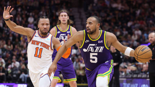 Dec 13, 2023; Salt Lake City, Utah, USA; Utah Jazz guard Talen Horton-Tucker (5) drives to the basket by New York Knicks guard Jalen Brunson (11) during the fourth quarter at Delta Center. 