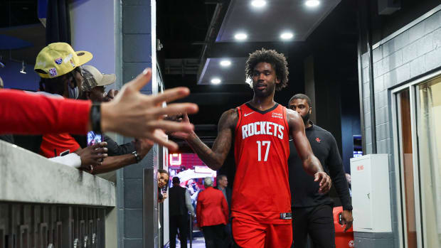 Houston Rockets forward Tari Eason (17) is congratulated by fans after the game against the San Antonio Spurs at Toyota Center.