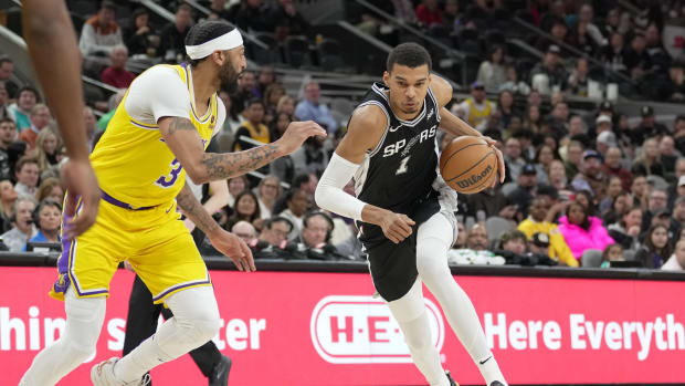 San Antonio Spurs center Victor Wembanyama (1) dribbles against Los Angeles Lakers forward Anthony Davis (3) in the first half at the Frost Bank Center.