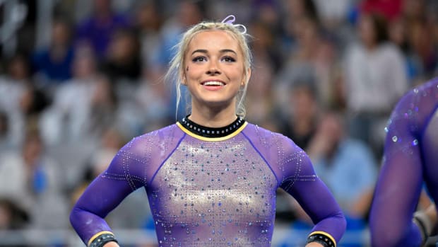 Apr 15, 2023; Fort Worth, TX, USA; LSU Tigers gymnast Olivia Dunne warms up with her team on floor during the NCAA Women's National Gymnastics Tournament Championship at Dickies Arena. 