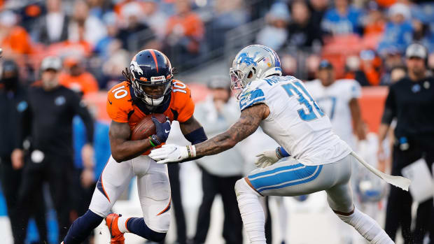 Denver Broncos wide receiver Jerry Jeudy (10) runs the ball as Detroit Lions safety Dean Marlowe (31) defends in the third quarter at Empower Field at Mile High.