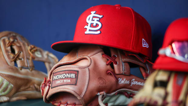 Sep 5, 2023; Atlanta, Georgia, USA; A detailed view of the hat and glove of St. Louis Cardinals second baseman Nolan Gorman (not pictured) before a game against the Atlanta Braves at Truist Park.