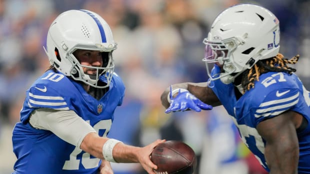 Indianapolis Colts quarterback Gardner Minshew II (10) hands the ball off to Indianapolis Colts running back Trey Sermon (27) on Saturday, Dec. 16, 2023, during a game against the Pittsburgh Steelers at Lucas Oil Stadium in Indianapolis.