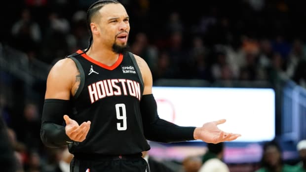 Houston Rockets' Dillon Brooks reacts after a call during the first half of an NBA basketball game against the Milwaukee Bucks, Sunday, Dec. 17, 2023, in Milwaukee. (AP Photo/Aaron Gash)   