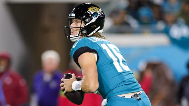 Trevor Lawrence looks to throw against the Ravens.