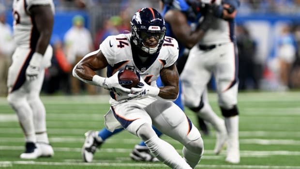 Dec 16, 2023; Detroit, Michigan, USA; Denver Broncos wide receiver Courtland Sutton (14) runs with the ball against the Detroit Lions in the third quarter at Ford Field. Mandatory Credit: Lon Horwedel-USA TODAY Sports  