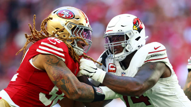 San Francisco 49ers offensive tackle Spencer Burford (74) blocks San Francisco 49ers defensive end Chase Young (92) during the first quarter at State Farm Stadium.