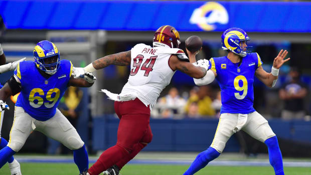 Dec 17, 2023; Inglewood, California, USA; Los Angeles Rams quarterback Matthew Stafford (9) throws as Washington Commanders defensive tackle Daron Payne (94) moves in during the first half at SoFi Stadium.