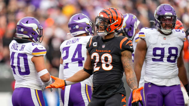 Cincinnati Bengals running back Joe Mixon (28) celebrates a first down run in the fourth quarter of the NFL Week 15 game between the Cincinnati Bengals and the Minnesota Vikings at PayCor Stadium in downtown Cincinnati on Saturday, Dec. 16, 2023. The Bengals won on an overtime field goal.  