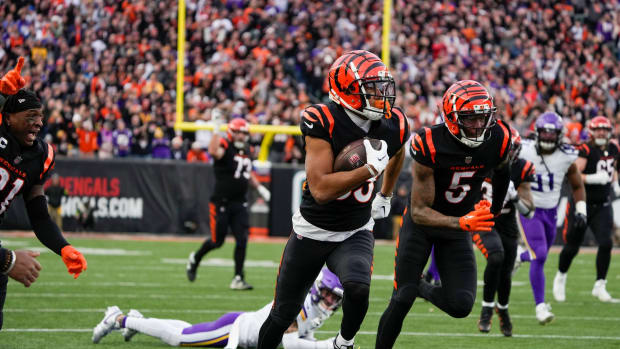 Cincinnati Bengals wide receiver Tyler Boyd (83) runs the ball in overtime against the Minnesota Vikings Paycor Stadium Saturday, December 16, 2023. The Bengals won 27-24 in overtime.  