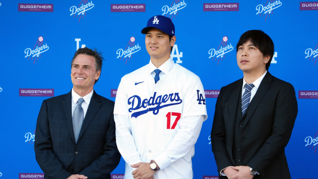 Dec 14, 2023; Los Angeles, CA, USA; Los Angeles Dodgers player Shohei Ohtani stands with his agent Nez Balelo (left) and interpreter Ippei Mizuhara at an introductory press conference at Dodger Stadium.