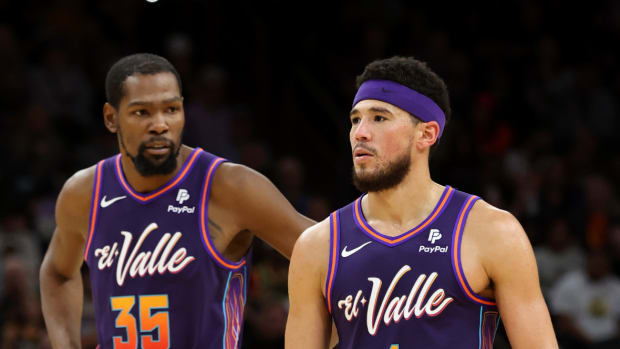 Phoenix Suns guard Devin Booker (1) and forward Kevin Durant (35) on the court against the Washington Wizards during the second half at Footprint Center.