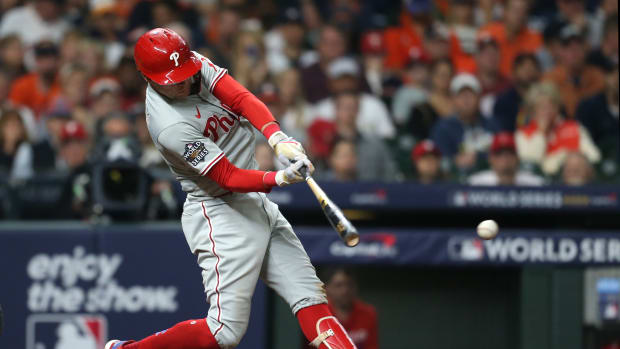 Oct 29, 2022; Houston, Texas, USA; Philadelphia Phillies first baseman Rhys Hoskins (17) hits single during the sixth inning against the Houston Astros in game two of the 2022 World Series at Minute Maid Park. Mandatory Credit: Thomas Shea-USA TODAY Sports