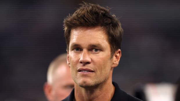 Former NFL quarterback Tom Brady attends a Raiders-Cowboys game.