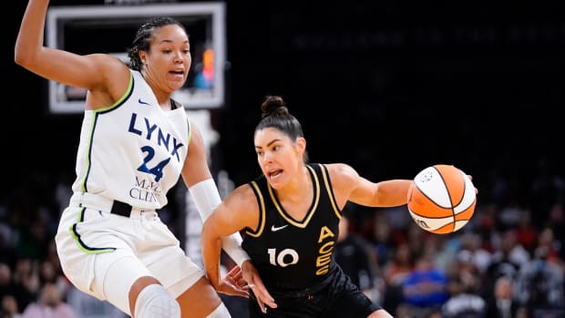May 28, 2023; Las Vegas, Nevada, USA; Las Vegas Aces guard Kelsey Plum (10) drives the ball against Minnesota Lynx forward Napheesa Collier (24) during the third quarter at Michelob Ultra Arena.