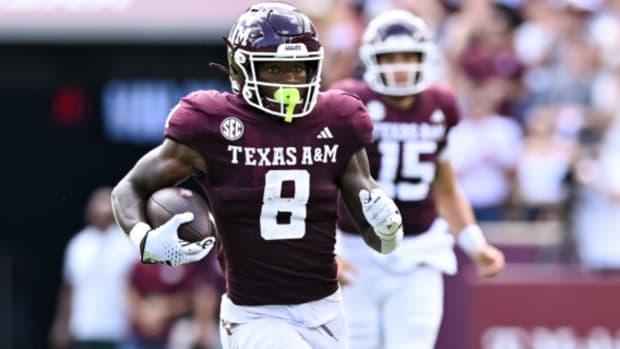 Texas A&M running back Le'Veon Moss on a rushing attempt during a college football game in the SEC.